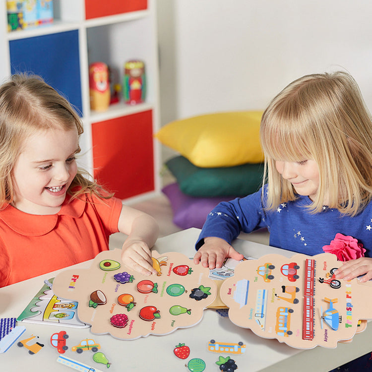 Kids playing busy book