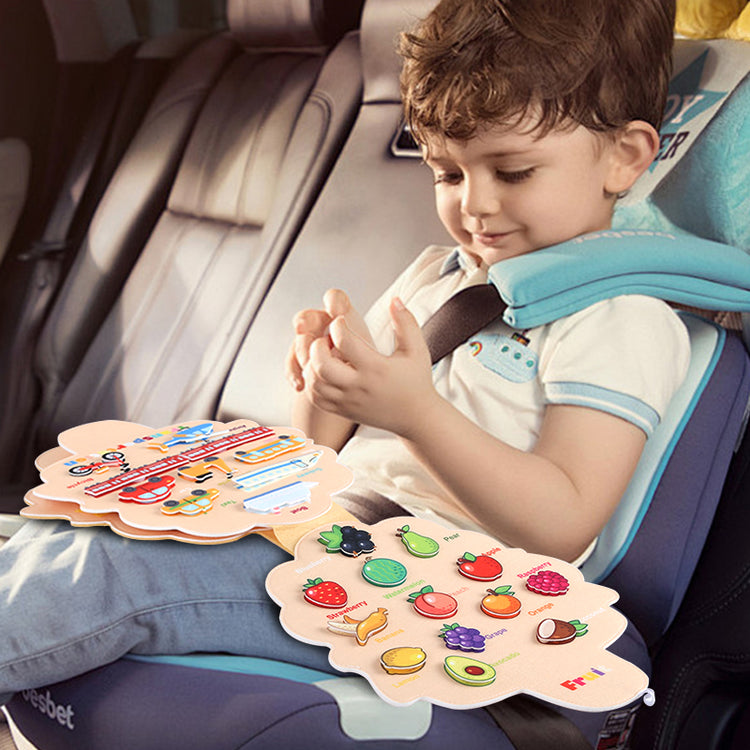 Kids playing busy book in car