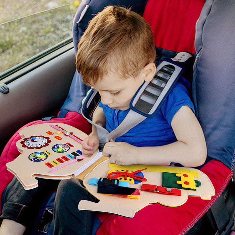 kids playing busy book in car