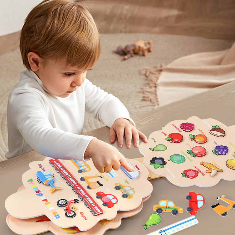 Kids playing busy book