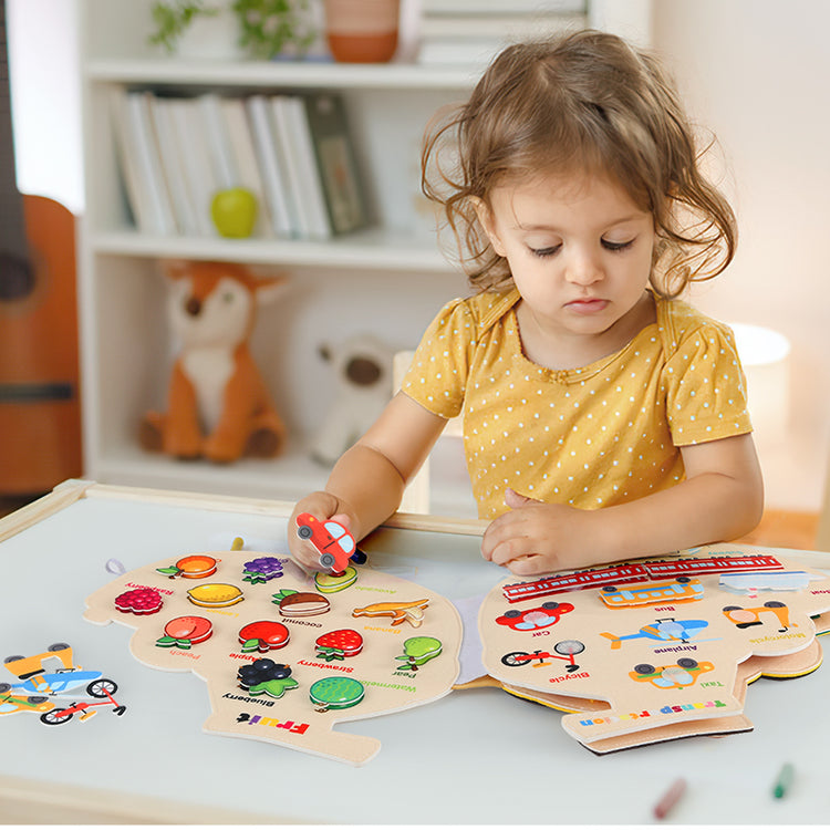 kids playing busy book