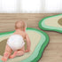Baby climbing on avocado gym mat