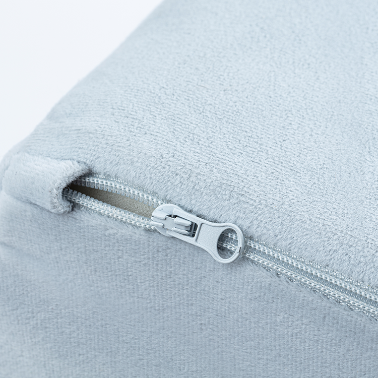Close-up of the zipper on the Tangram puzzle play couch's cover.