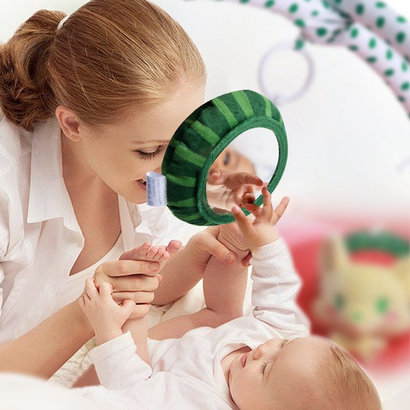 Baby and mom playing with sensory toys