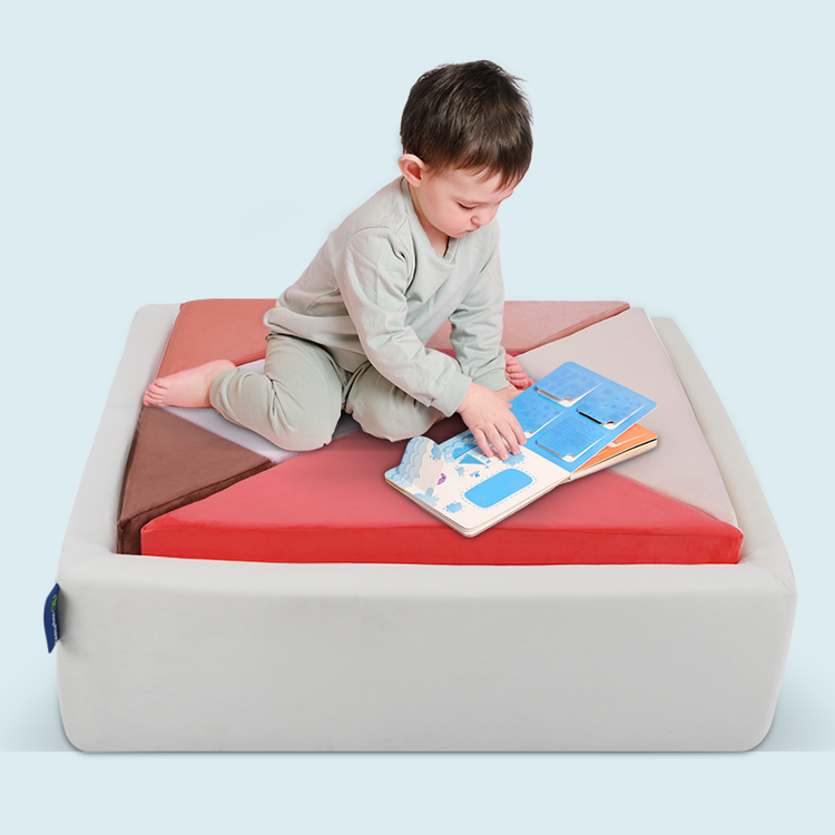 baby sitting on glow Tangram sofa