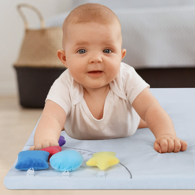 Baby laying on the sensory mat