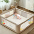Baby climbing on the beige sensory mat