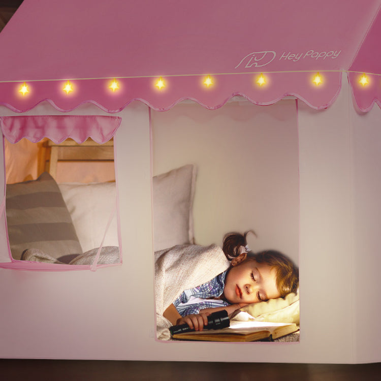 Kid sleeping in pink tent