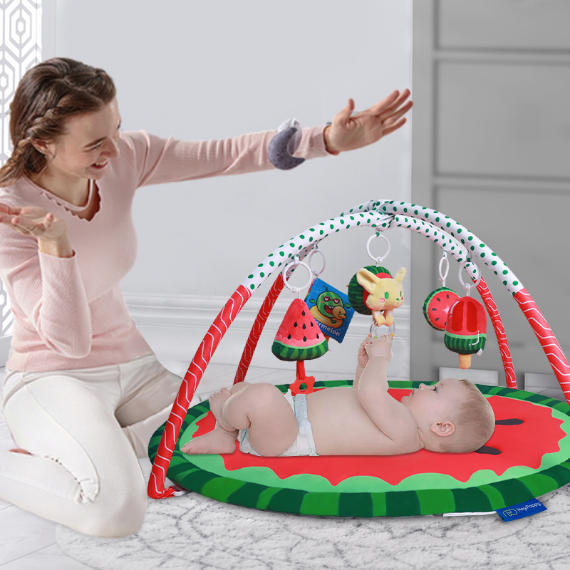 Side display of watermelon baby play gym mat,hanging four watermelon dolls of different shapes and one audio book.