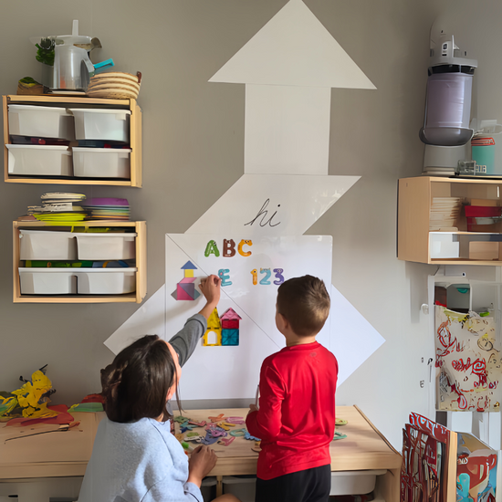 Little boy and mom spelling with magnetic board
